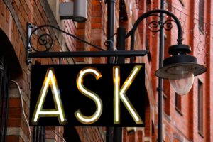 Neon sign with ask. It all starts with a structured word question